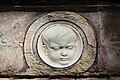 Detail of a marble medallion on the grave of Dantan